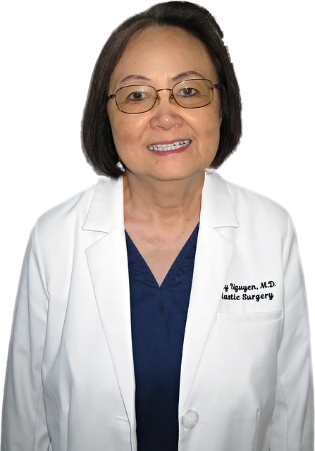Thuy T. Nguyen, M.D., F.A.C.S., smiling, in her white coat